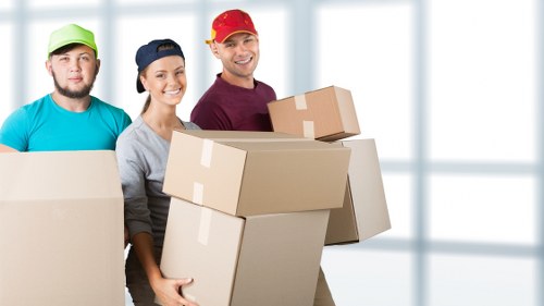 Professional packing team preparing boxes for a move in Uxbridge