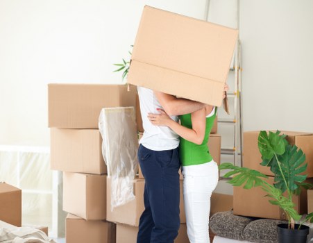 Person organizing boxes in a Uxbridge storage unit